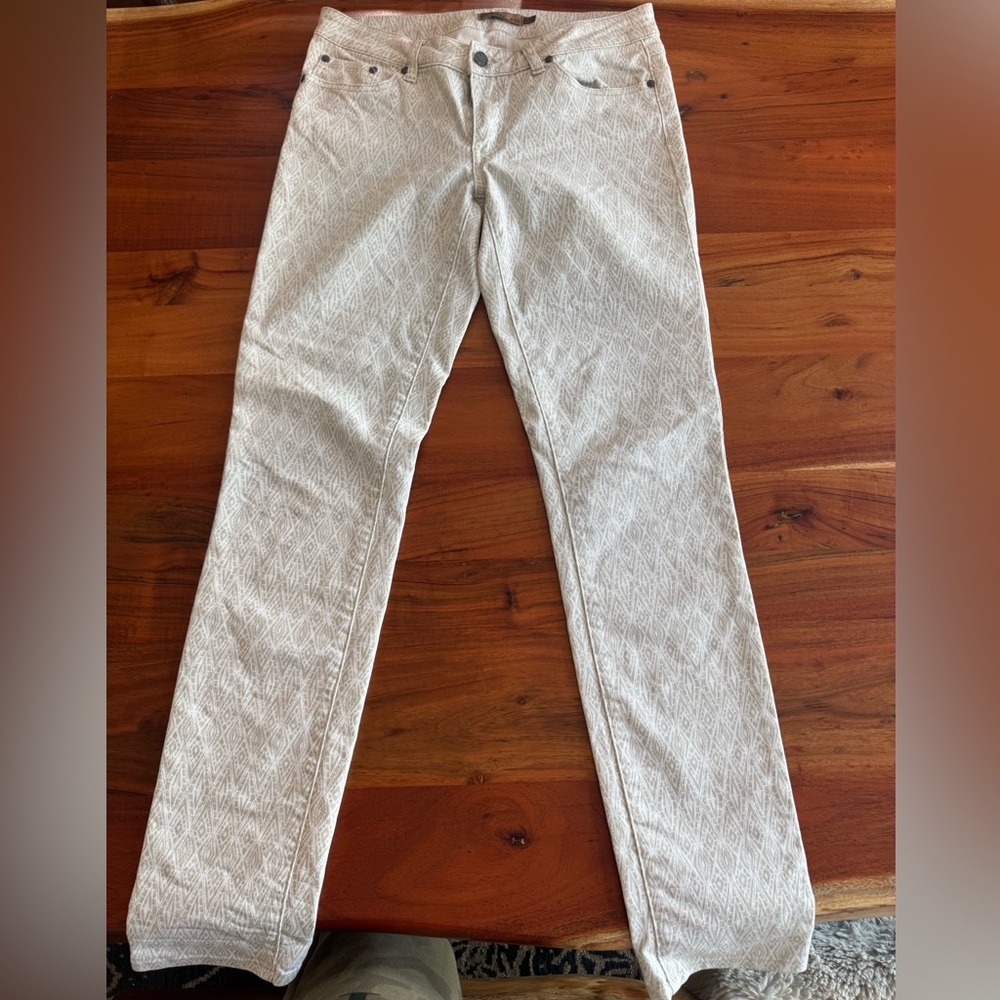 White and light brown Prana stretch jeans.